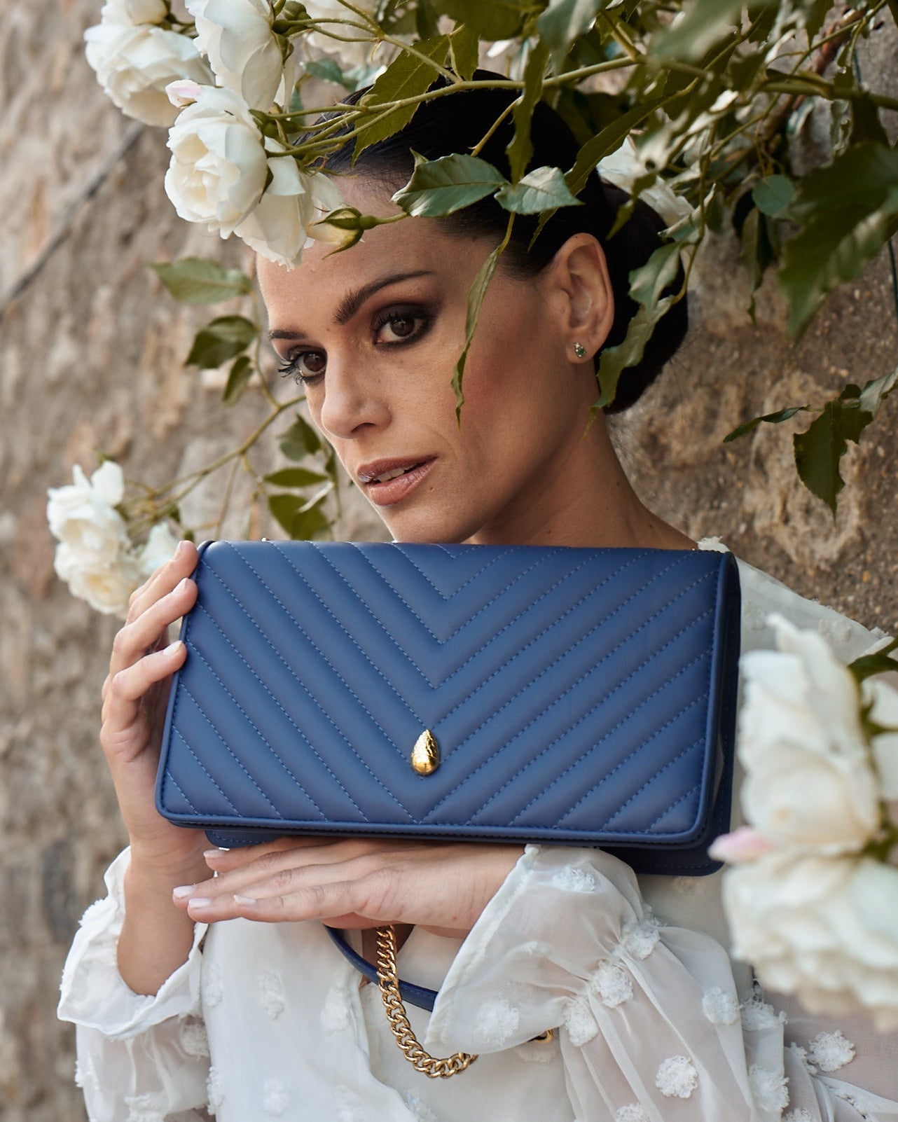 Close-up of navy leather texture showing quality and craftsmanship
