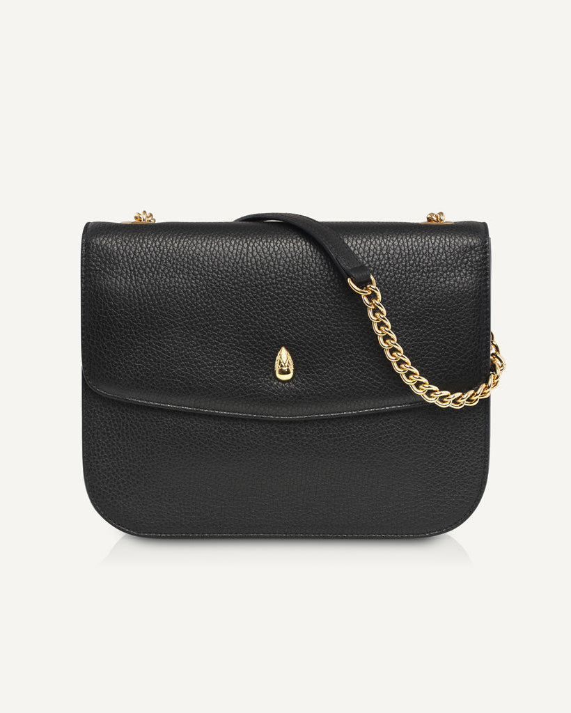 black leather shoulder bag with gold chain strap front view isolated