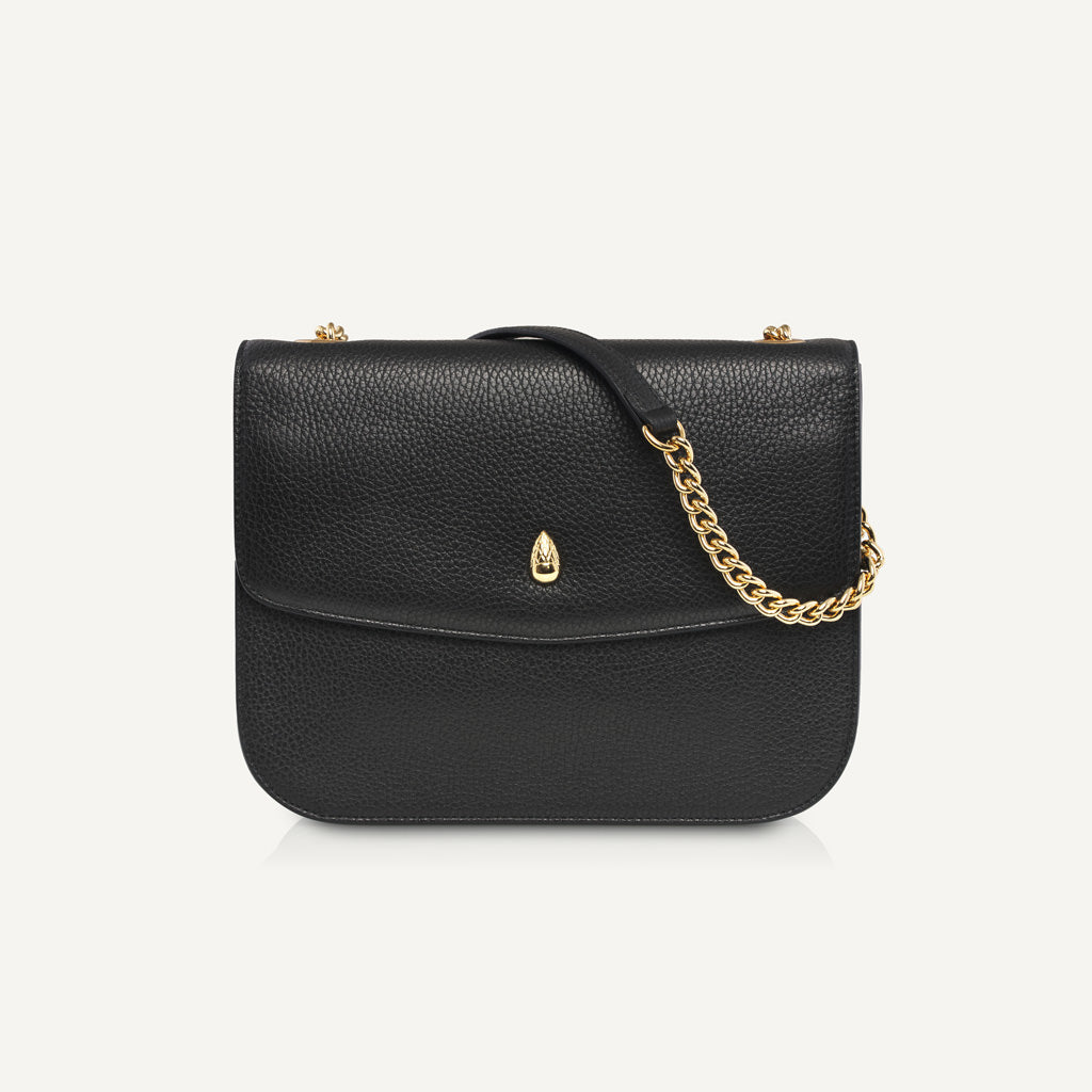 black leather shoulder bag with gold chain strap front view isolated
