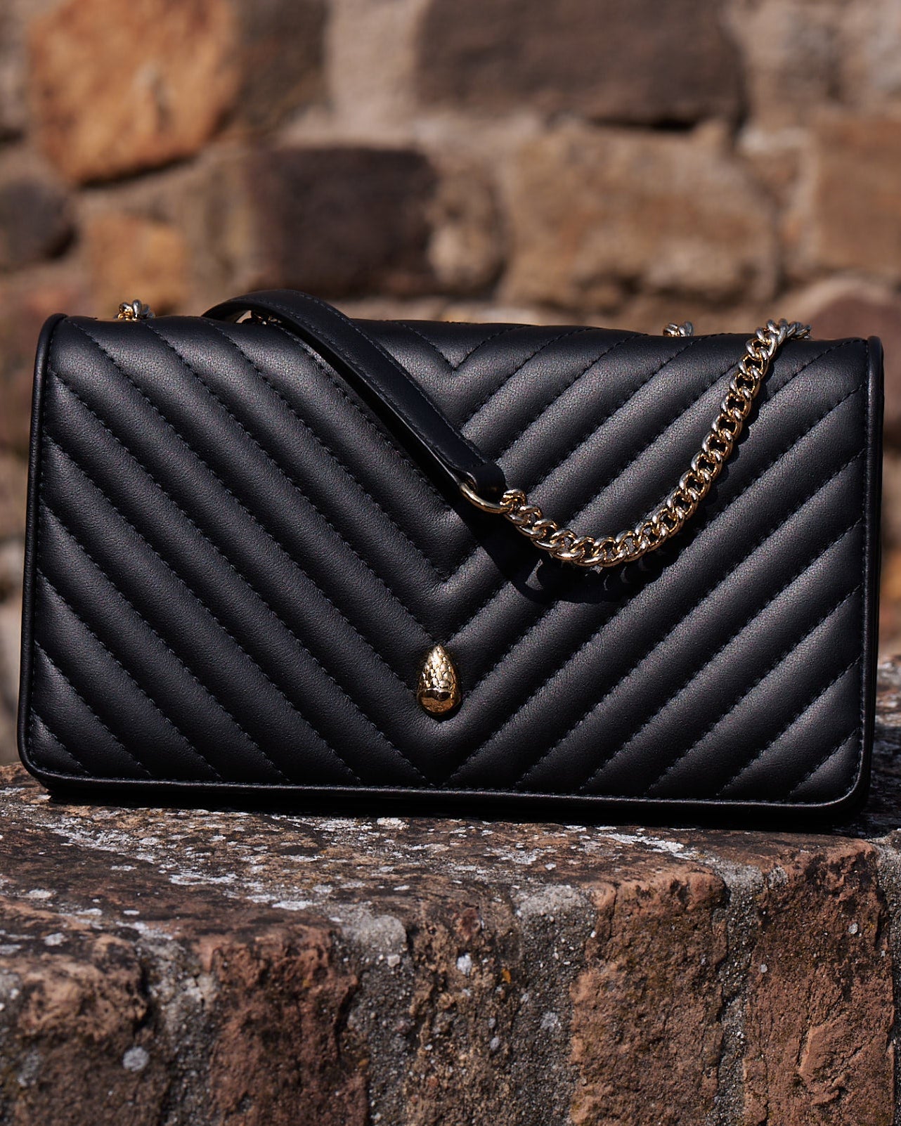 Black quilted leather crossbody bag for women front view – Menière Paris