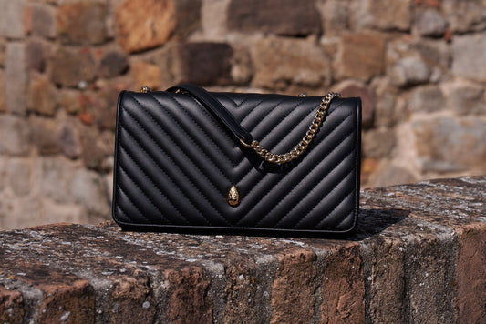 Black quilted leather crossbody bag for women front view – Menière Paris