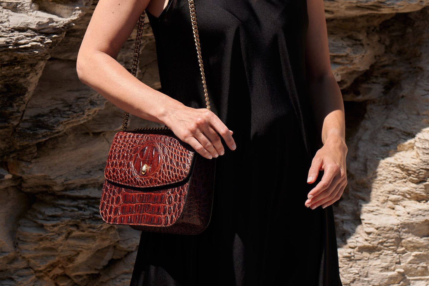 luxury-grand-dauphin-brown-croc-embossed-leather-bag-worn-on-shoulder-showcasing-elegant-design-and-gold-chain-strap