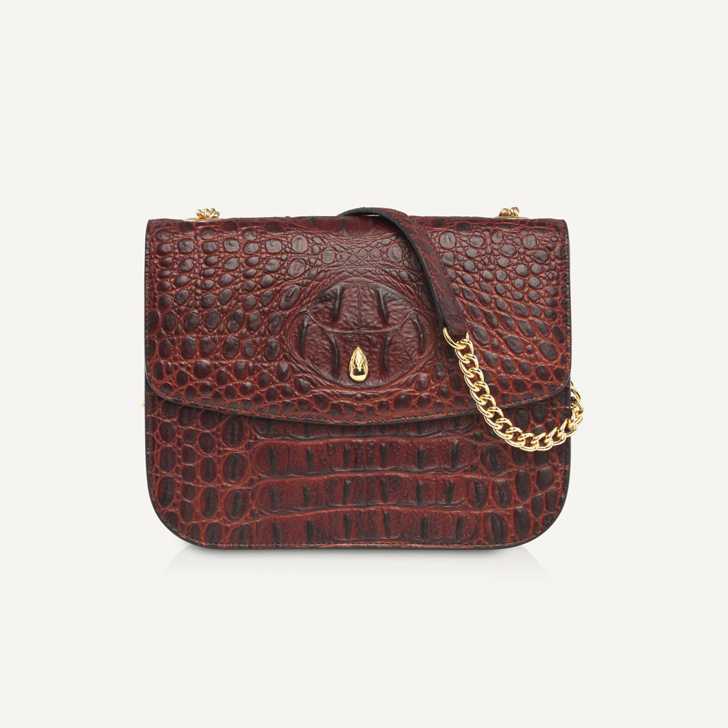studio-shot-of-grand-dauphin-brown-croc-embossed-leather-bag-highlighting-structure-and-premium-finish
