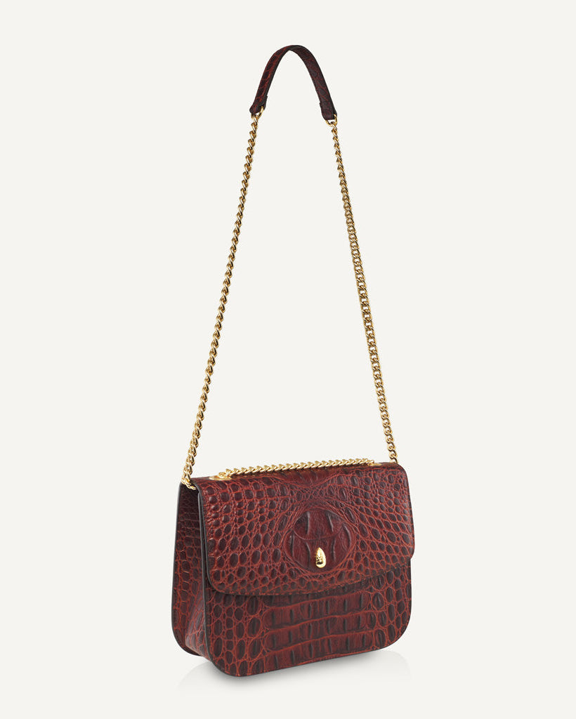 close-up-of-grand-dauphin-brown-croc-embossed-leather-bag-featuring-elegant-gold-chain-strap-detail