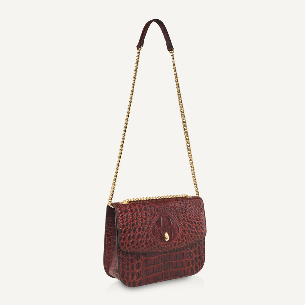 close-up-of-grand-dauphin-brown-croc-embossed-leather-bag-featuring-elegant-gold-chain-strap-detail