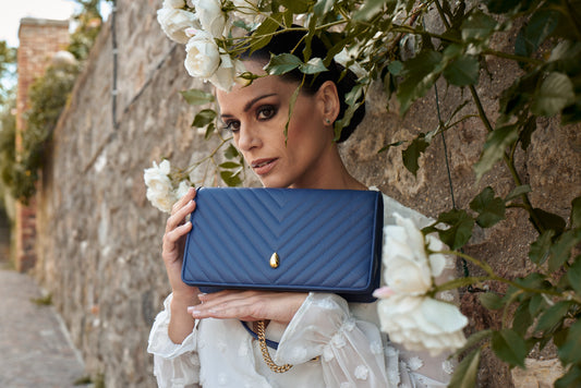 Close-up of navy leather texture showing quality and craftsmanship